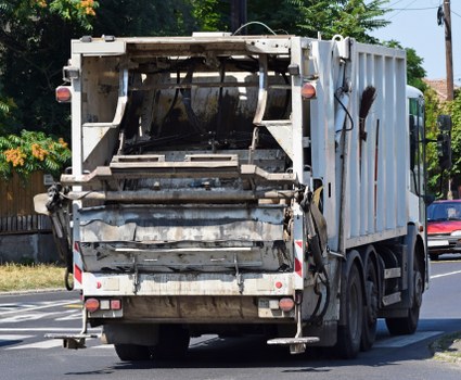 Assistive technology user interacting with skip hire booking interface